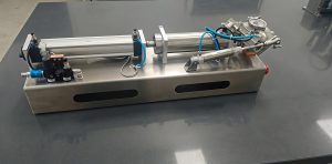 Side view of GC-A liquid filling machine showing stainless steel frame and single nozzle
